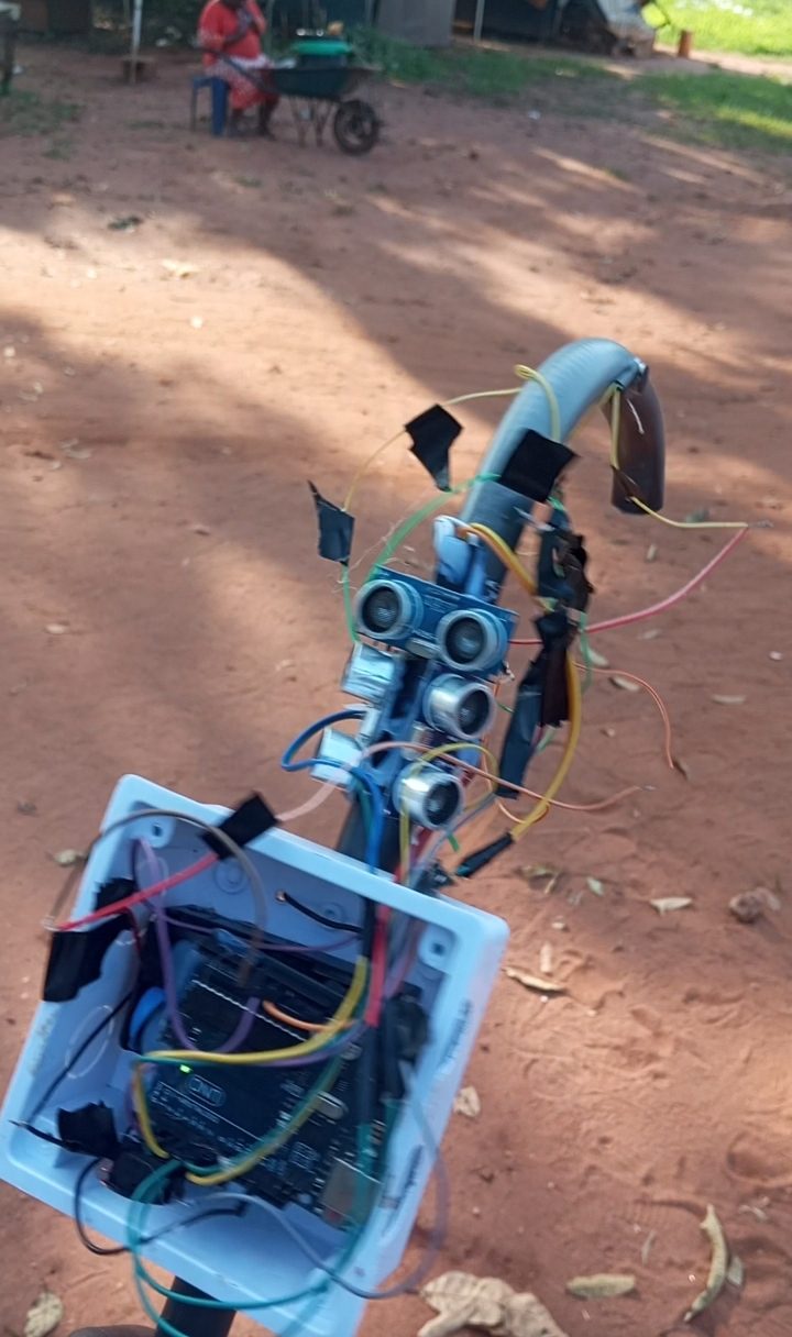 The walking stick's sensor head and controller in use